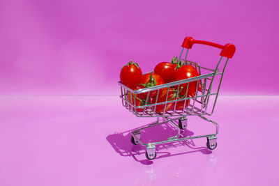Close-up of cherry tomatoes against red background