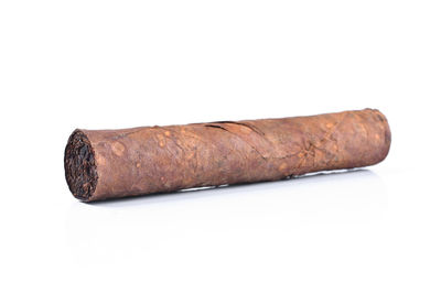 Close-up of cigarette against white background