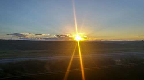 Sun shining over landscape