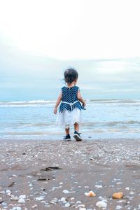 Little girl by the beach