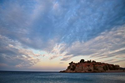 Scenic view of sea against cloudy sky