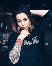 Portrait of beautiful young woman standing outdoors