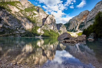 Scenic view of lake and mountains against sky