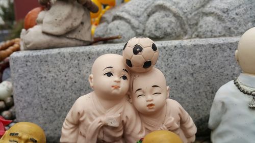Close-up of statues for sale at market