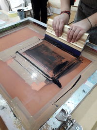 High angle view of man working on table