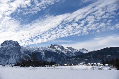 Scenic view of snowcapped mountains against sky