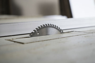 Wood cutter machine, metal saw blade machine, photograph of cutting wood by carpenter in workshop