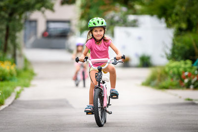 Portrait of girl riding bicycle