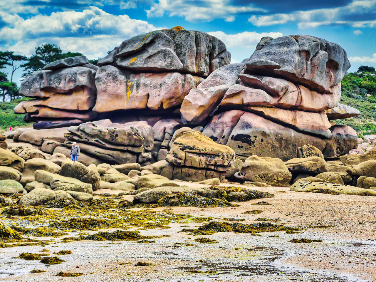 ROCKS ON SHORE AGAINST SKY