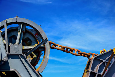 Low angle view of ferris wheel against sky