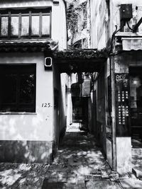 Narrow alley along built structures