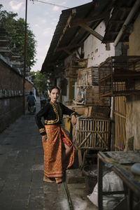 Full length of woman in traditional clothing standing outdoors