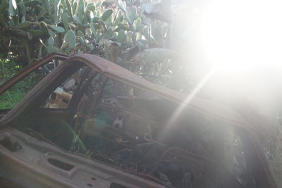 Close-up of abandoned car on sunny day