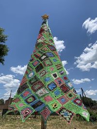 Low angle view of decoration on tree against sky