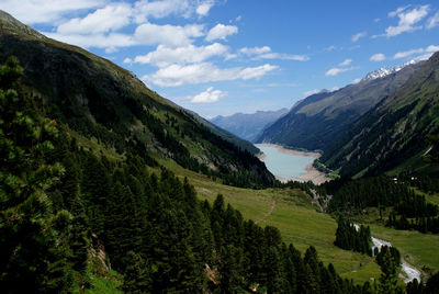 Scenic view of landscape and mountains against sky