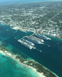 High angle view of sea and cityscape against sky
