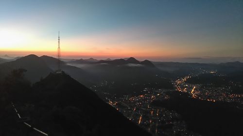 Aerial view of city at sunset