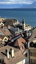 High angle view of townscape by sea