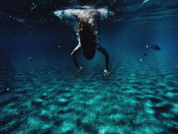 Woman swimming in sea