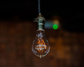 Close-up of illuminated light bulb