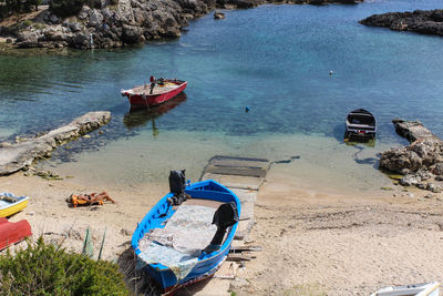 High angle view of boats moored on shore