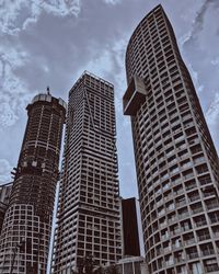 Low angle view of modern buildings against sky