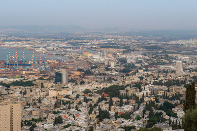 High angle view of city buildings against sky