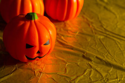 Close-up of pumpkin and red chili peppers during halloween