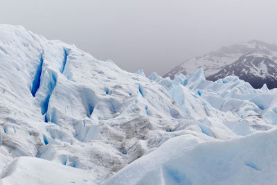 Scenic view of glacier against clear sky