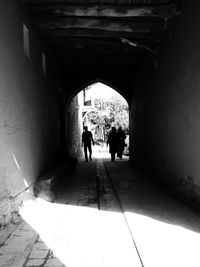 People walking in tunnel