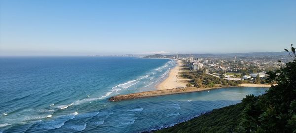 High angle view of sea against clear blue sky