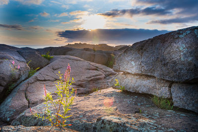 Scenic view of rock formation against sky during sunset