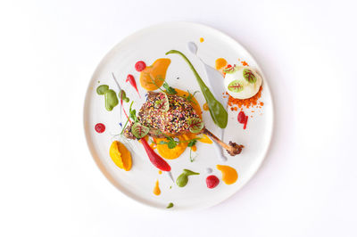 High angle view of food in plate on white background