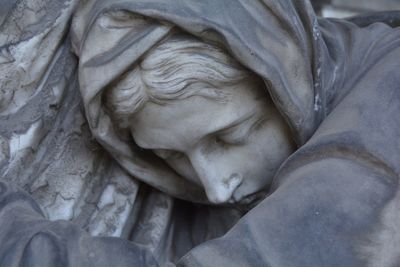 Close-up of sleeping statue