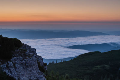 Scenic view of landscape against dramatic sky