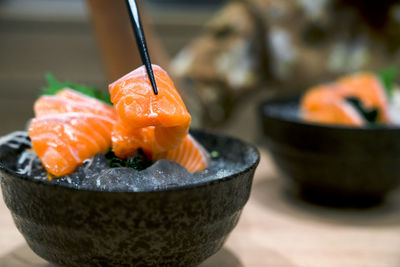 Close-up of orange fish in bowl