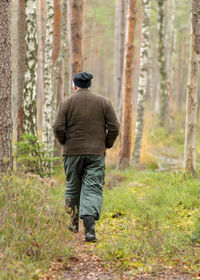 Rear view of man standing on field