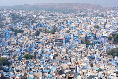 High angle view of townscape against cityscape