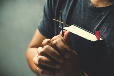 Close-up of man holding book
