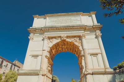 Low angle view of historical building against blue sky