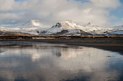 Scenic view of snowcapped mountains against sky