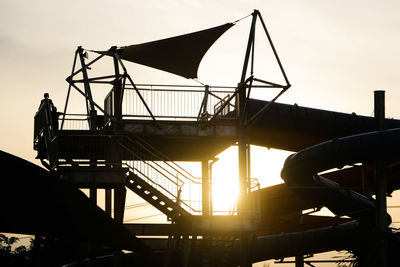 Low angle view of silhouette people against sky