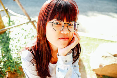 Close-up of young woman looking away