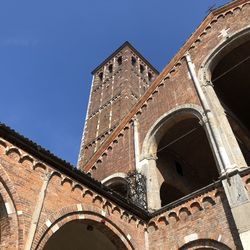 Low angle view of historical building against clear blue sky