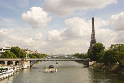 Bridge over river with city in background