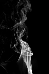 Close-up of smoke against black background