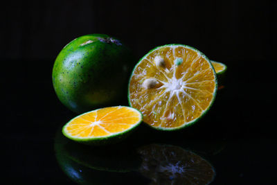 Close-up of oranges against black background