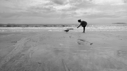 Full length of man on beach against sky