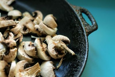 High angle view of mushrooms in container on table