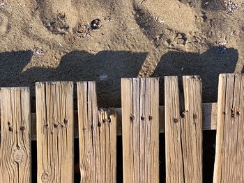 High angle view of wooden fence on beach